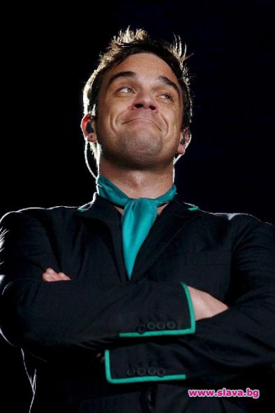 Роби се събира с Take That